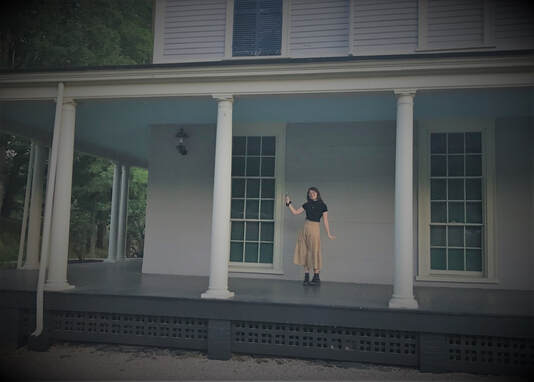 Méabh Stanford new female indie pop artists stands on porch where Laurie and Jo danced in Little Women 2019